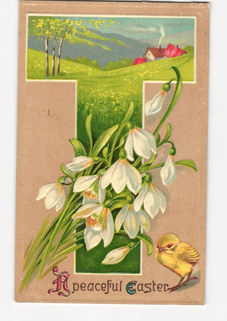Easter postcard with a large letter T filled with a spring landscape, snowdrops, and a chick: A chromolithograph postcard features a large decorative capital letter 'T' as a central motif. The 'T' is filled with a vibrant spring landscape depicting a grassy hillside, several trees with green f