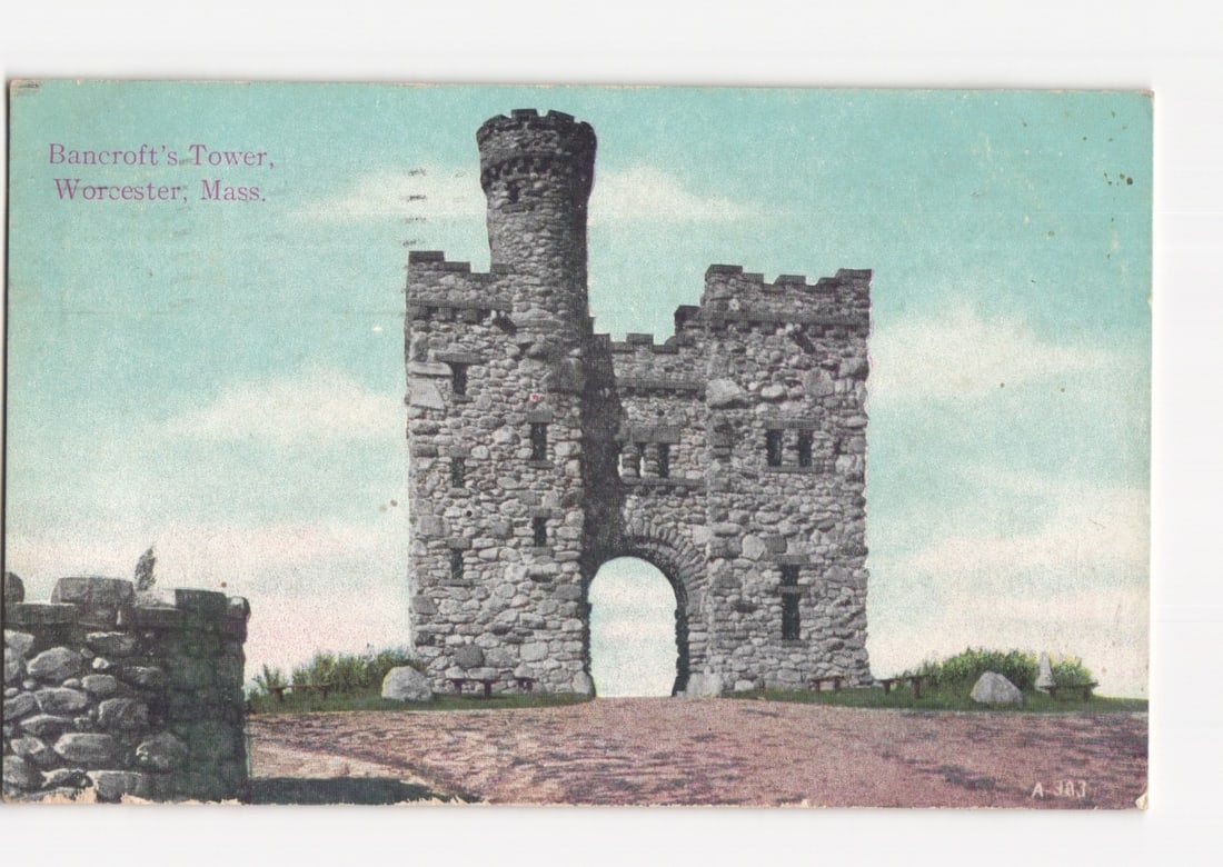 Historic Bancroft's Tower in Worcester, Massachusetts, circa 1911 architectural view postcard.: Bancroft's Tower, a substantial stone structure with a central arched entrance and a crenellated circular tower on its left, stands prominently on a low hill. The tower features numerous small window 