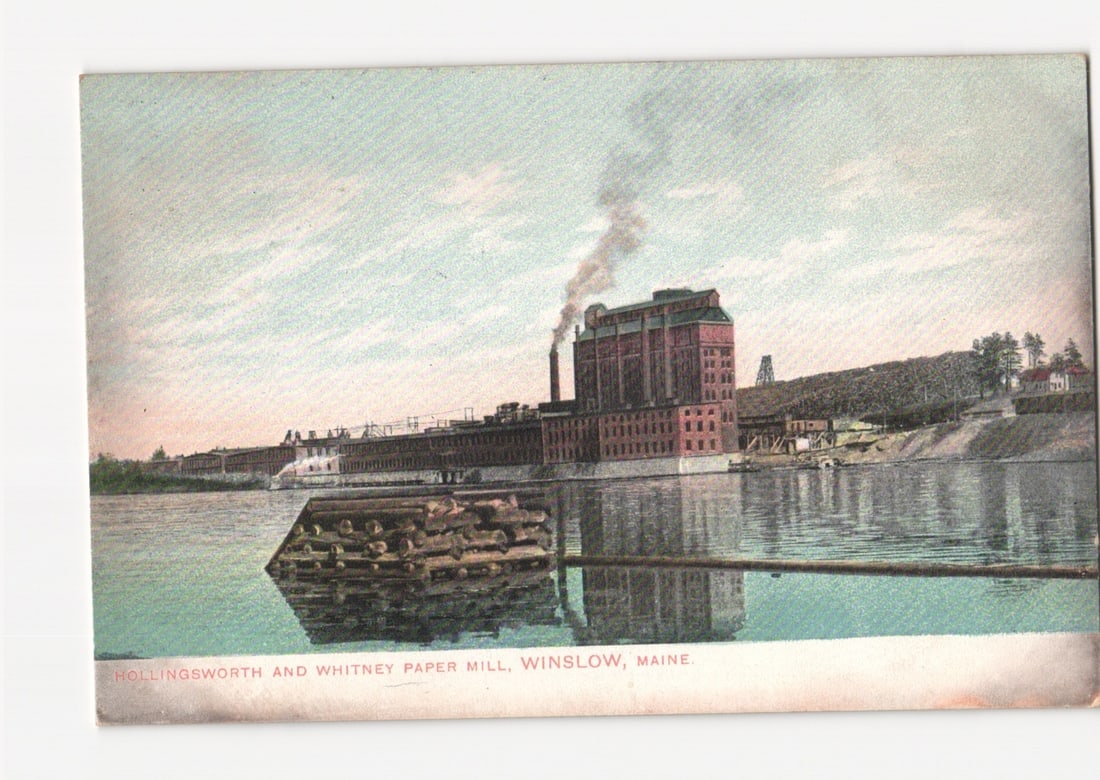 Industrial landscape postcard: Hollingsworth and Whitney Paper Mill, Winslow, Maine, circa 1910.: A large industrial complex identified as the Hollingsworth and Whitney Paper Mill is depicted, situated on the banks of a wide body of water in Winslow, Maine. Smoke or steam billows from a prominent 