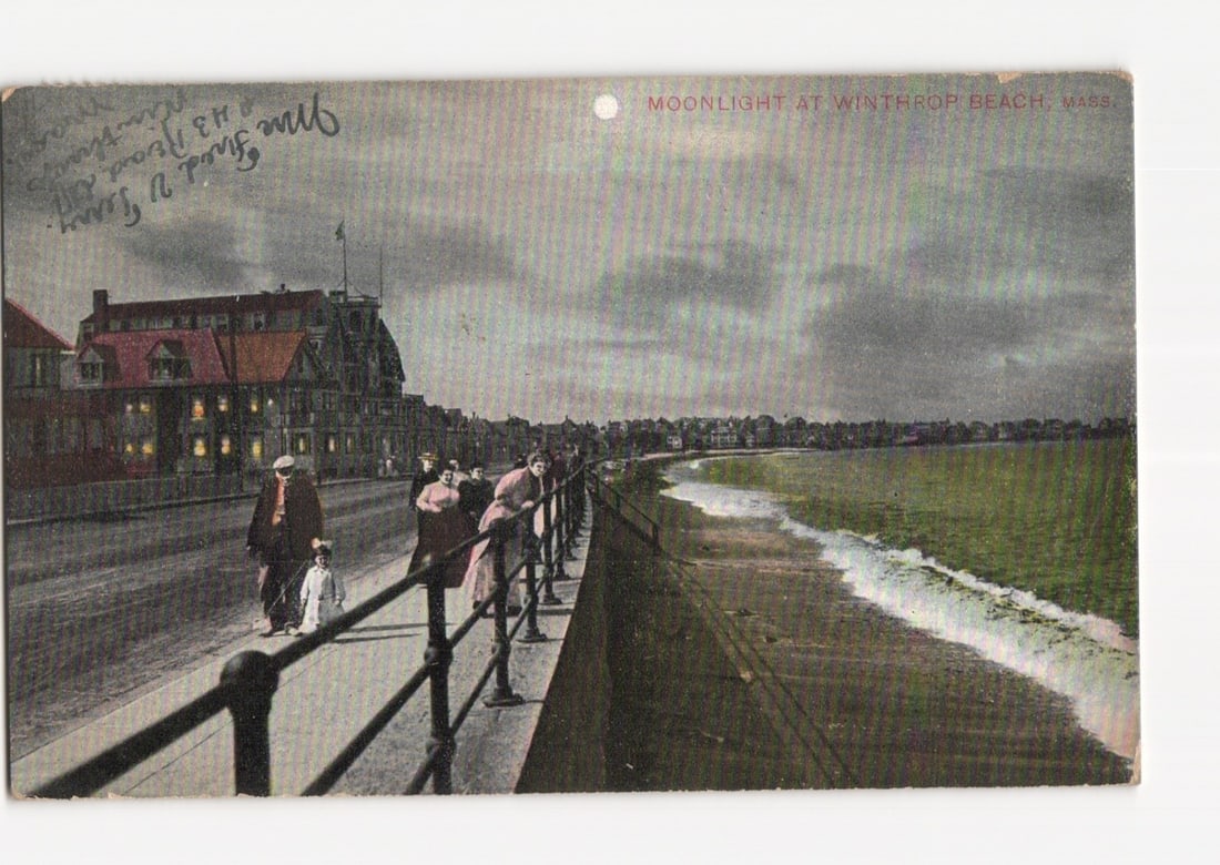 Early 20th Century Moonlight at Winthrop Beach, Massachusetts, Coastal Promenade postcard: Moonlight scene depicting a coastal promenade and beach. Several pedestrians, including adults and a child, stroll along a dark-railed promenade. To the left, a large multi-story building with numerou