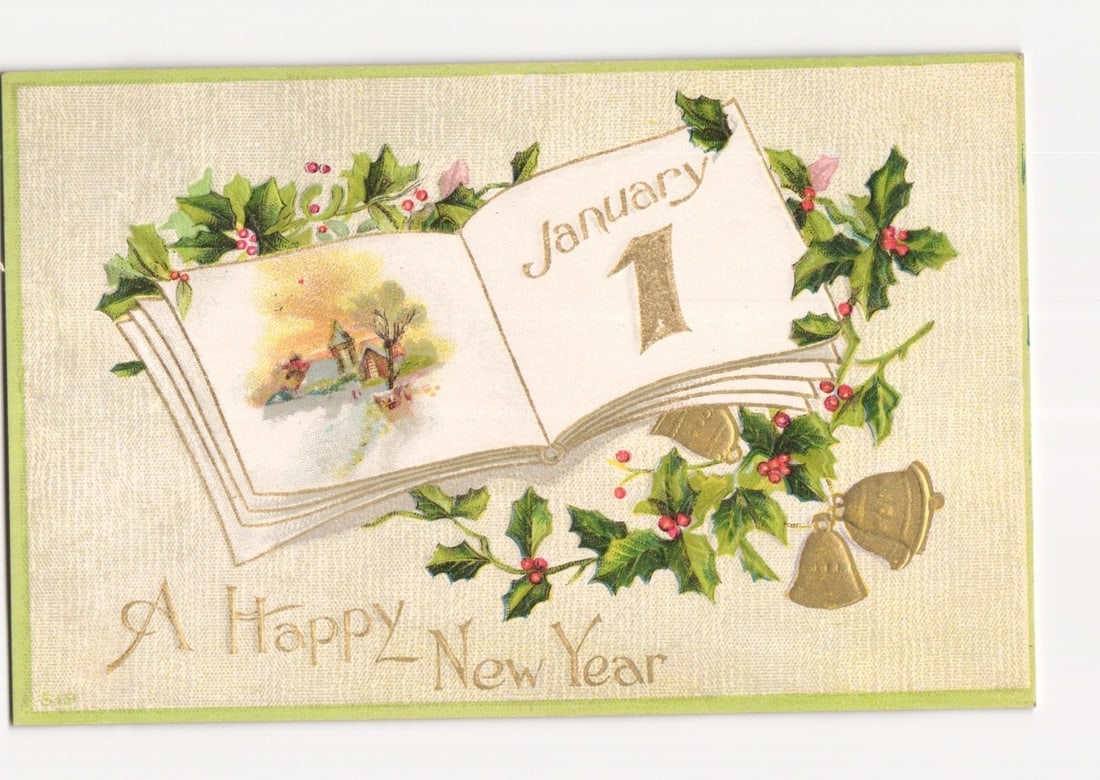 New Year Chromolithograph postcard with 'January 1' Book, Holly, and Embossed Bells: An open book is centrally depicted, with the left page illustrating a charming winter landscape featuring a small house amidst snowy trees. The right page displays the text "January 1" in decorative s