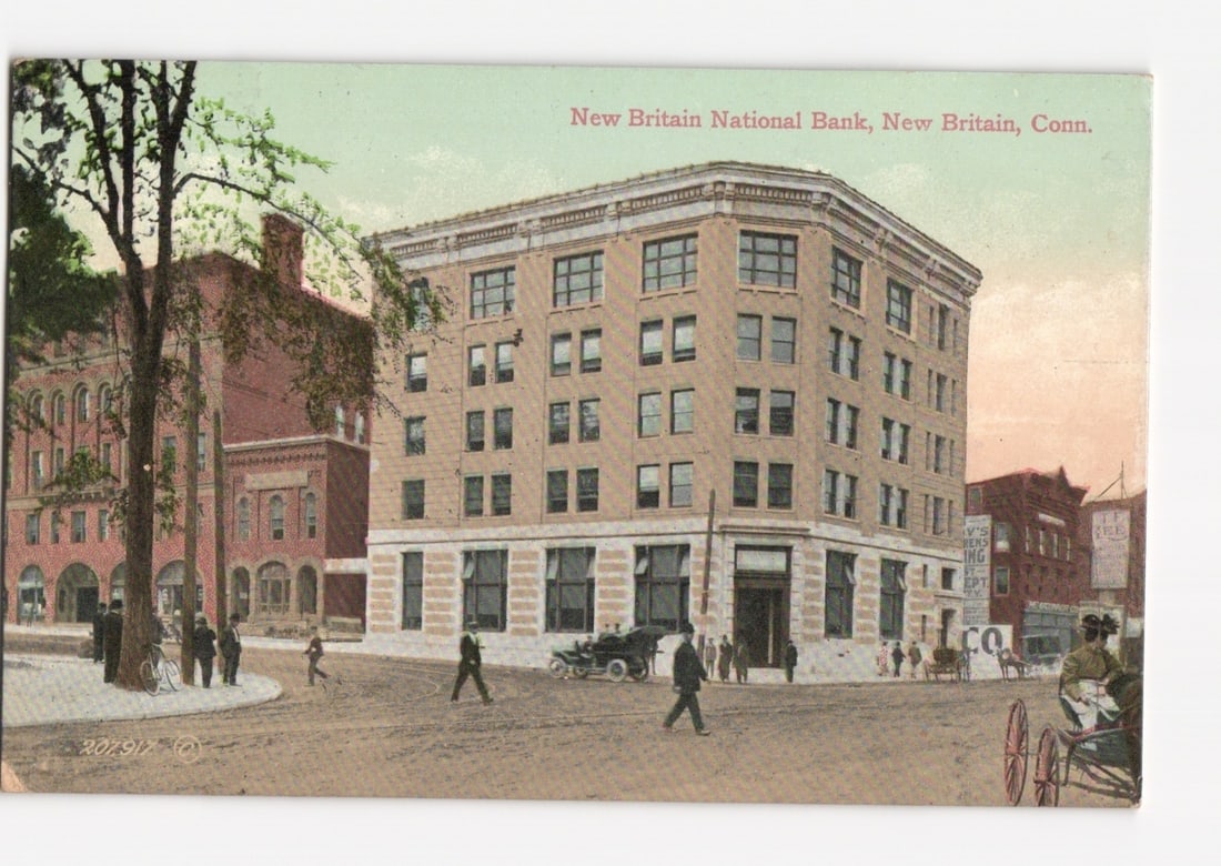 Historic New Britain National Bank Building, New Britain, Conn. Early 20th Century Lithograph: The New Britain National Bank building, a prominent multi-story structure with brick facade and stone trim, stands at a street corner. The building features numerous large windows and classical archit