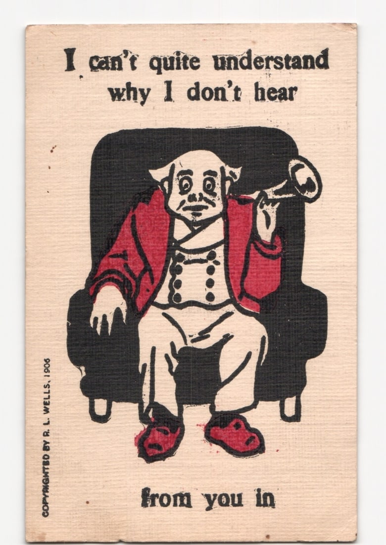 1908 Comic Postcard: Elderly Man with Ear Trumpet, 'I can't quite understand why I don't hear': A block color illustration depicts an elderly man seated in a black armchair. The man has a bald head, round features, and wears a red jacket over a white vest and white trousers, with red slippers. H