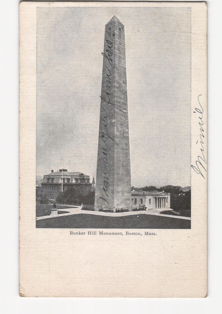 Boston's Historic Bunker Hill Monument, Massachusetts, c. 1908, Halftone Lithograph Postcard: Bunker Hill Monument, a tall granite obelisk, dominates the center of the vertical composition. It rises against a clear sky, with a base structure and ancillary buildings visible around its foundatio