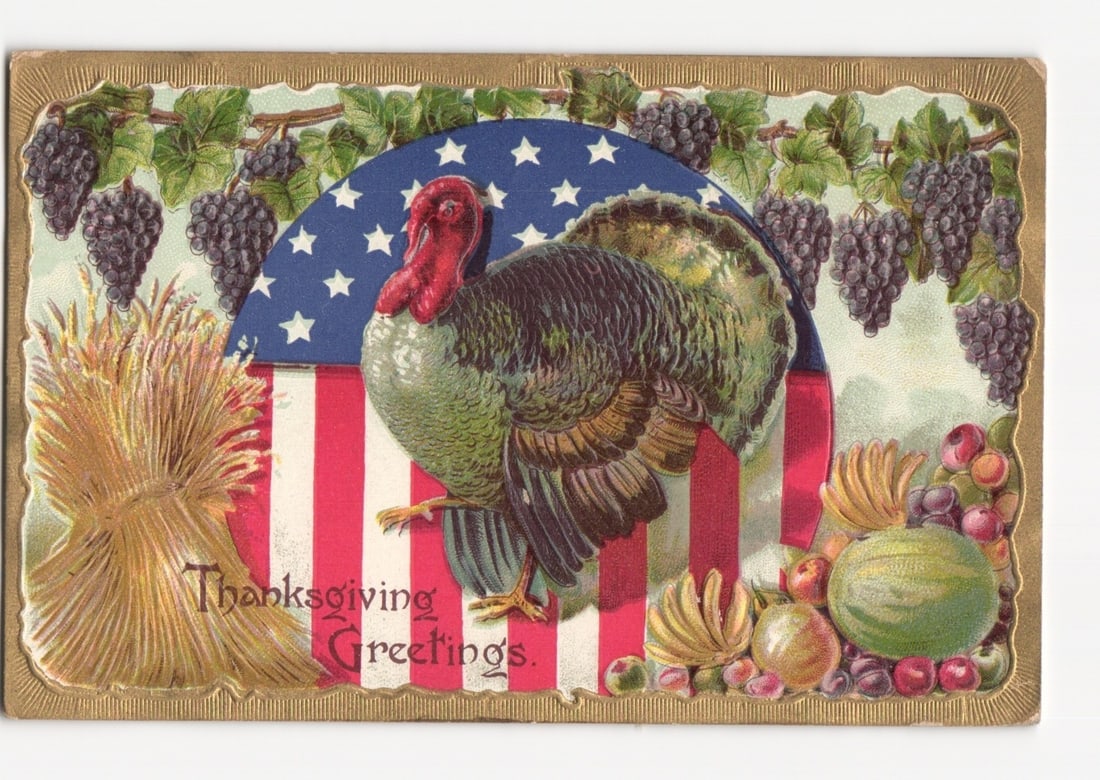 Thanksgiving Greetings Chromolithograph Postcard with Turkey, American Flag Motif, and Harvest: A large turkey with a red wattle and head, predominantly green and brown plumage, stands against a semi-circular American flag motif. The flag features a blue field with white stars at the top and red