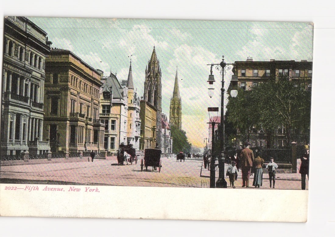 Early 20th Century Fifth Avenue, New York City Street Scene postcard with Spired Buildings: A broad street scene of Fifth Avenue, New York, featuring an array of multi-story buildings and two prominent Gothic-revival spired structures in the background. The thoroughfare is active with severa
