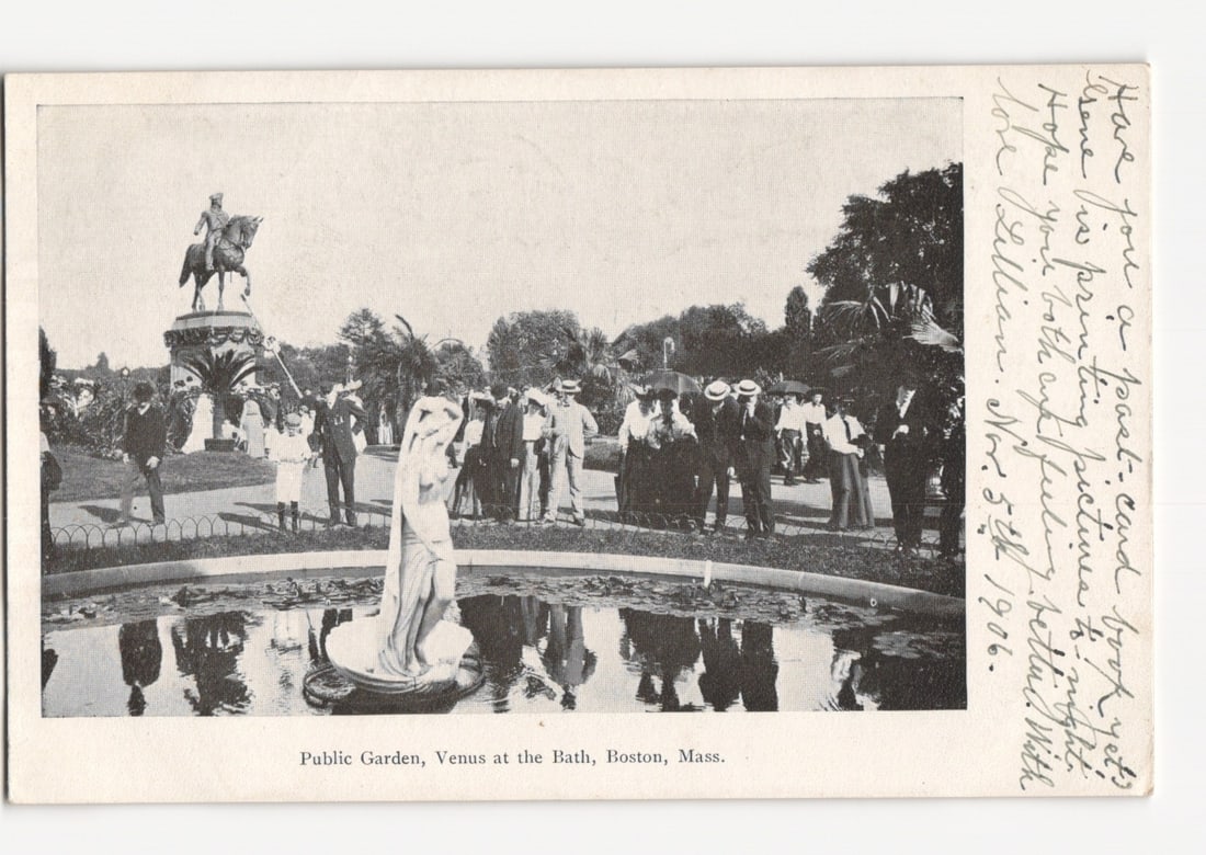 Early 20th C. Boston Public Garden: Venus at the Bath & Equestrian Statue postcard.: A black and white photographic postcard depicting the Boston Public Garden. The foreground features the "Venus at the Bath" statue, a classical white sculpture of a standing female figure, situated wi
