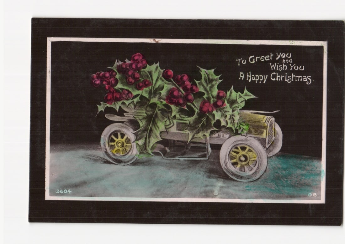 Vintage Christmas postcard: Antique automobile decorated with holly and berries, 'A Happy Christmas' (1 of 2)