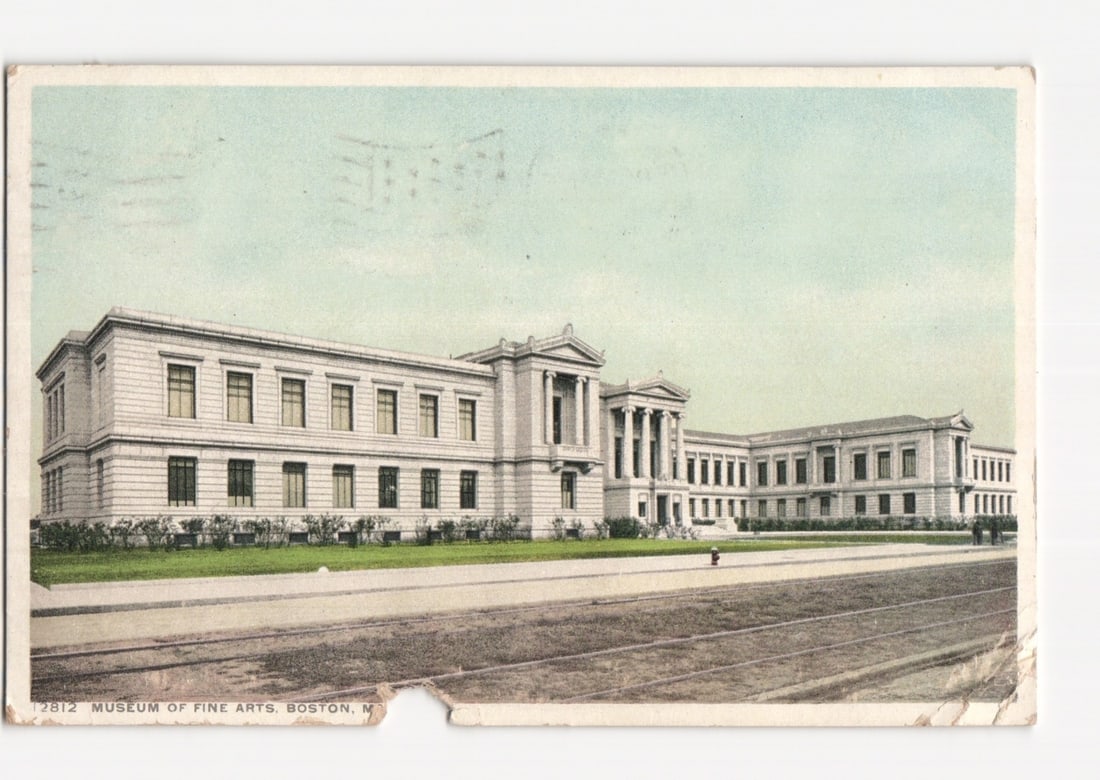Architectural postcard of the Museum of Fine Arts, Boston, Massachusetts, early 1900s.: A large, multi-sectioned neoclassical building with a central entrance featuring columns and a pediment. The building's facade is primarily light-colored stone, adorned with numerous windows arranged 