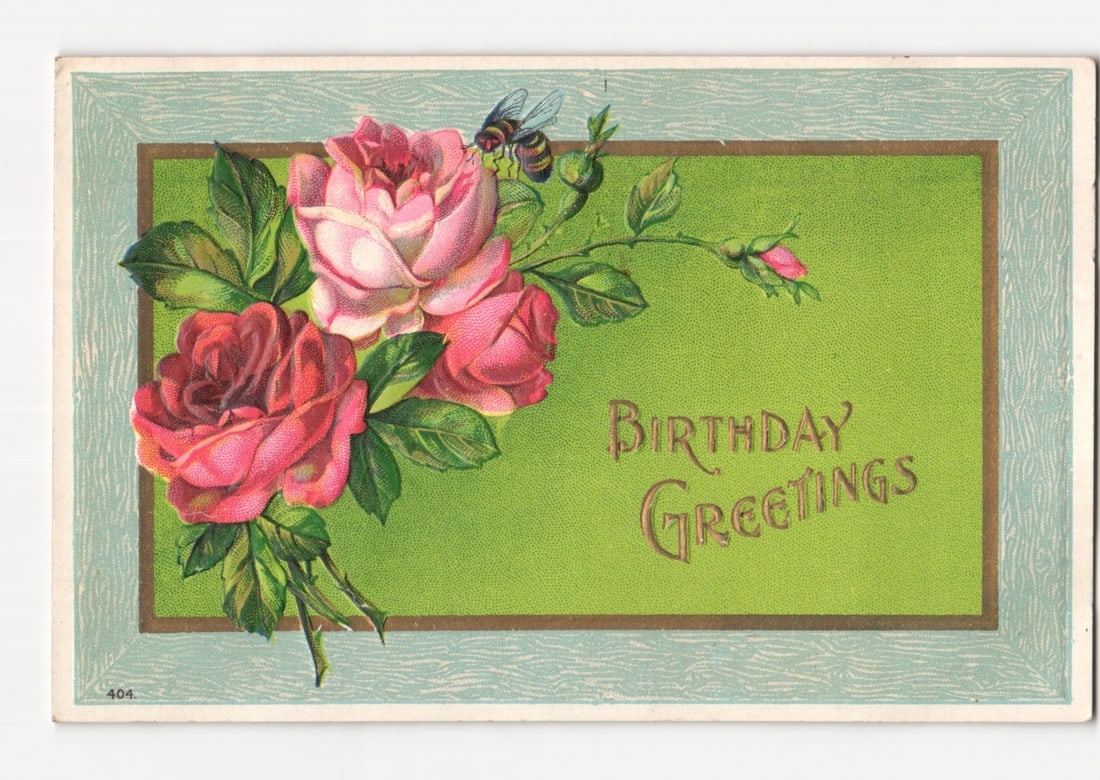 Early 20th-century Chromolithograph Postcard: Pink and Red Roses with Bee, Birthday Greetings: A chromolithograph postcard features a vibrant floral arrangement of pink and red roses with green foliage, positioned on the left side of the image. A bee is depicted in flight above the upper-left r