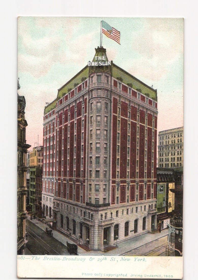 The Breslin Hotel at Broadway & 29th Street, New York City, 1905 color postcard: The Breslin Hotel, a prominent twelve-story corner building, is featured from an elevated perspective. The building displays a red brick facade with lighter architectural detailing and a distinctive g