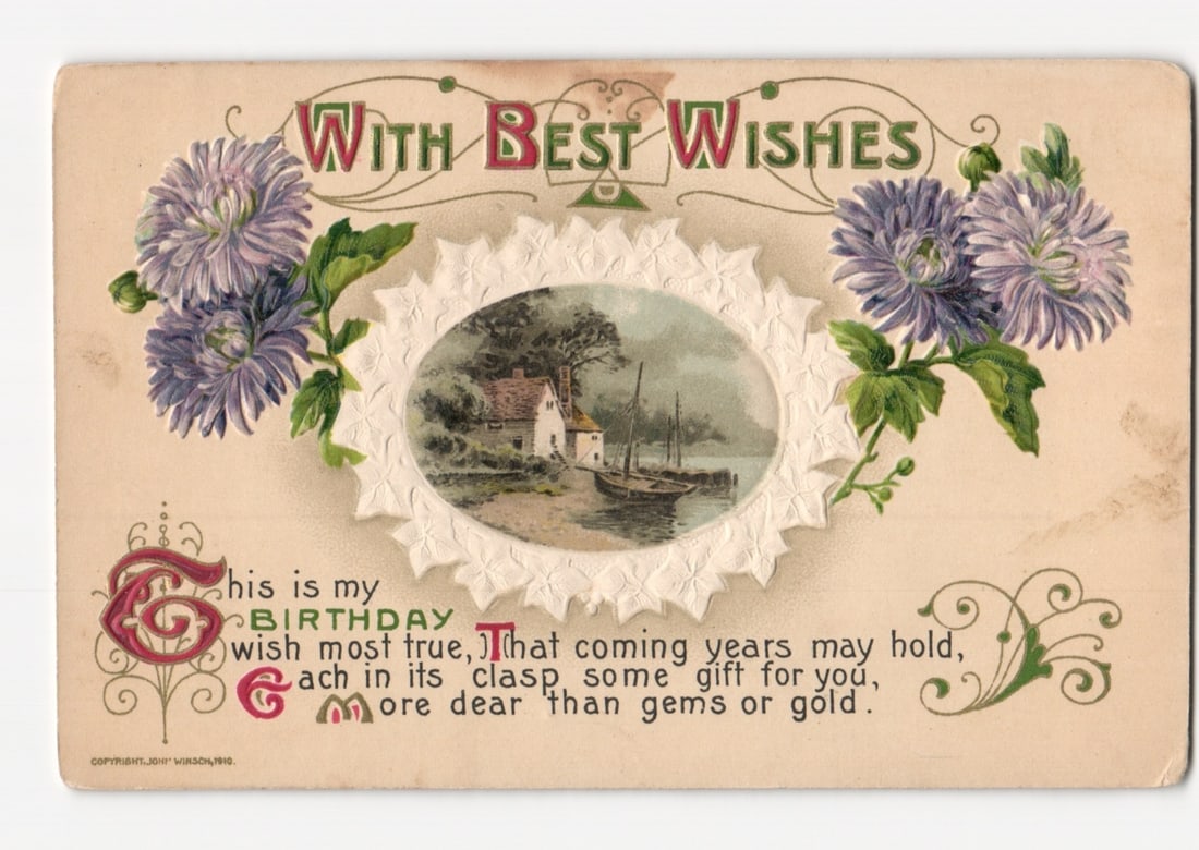 1910 Birthday Greeting postcard, featuring purple asters and a waterside home with boats (1 of 2)