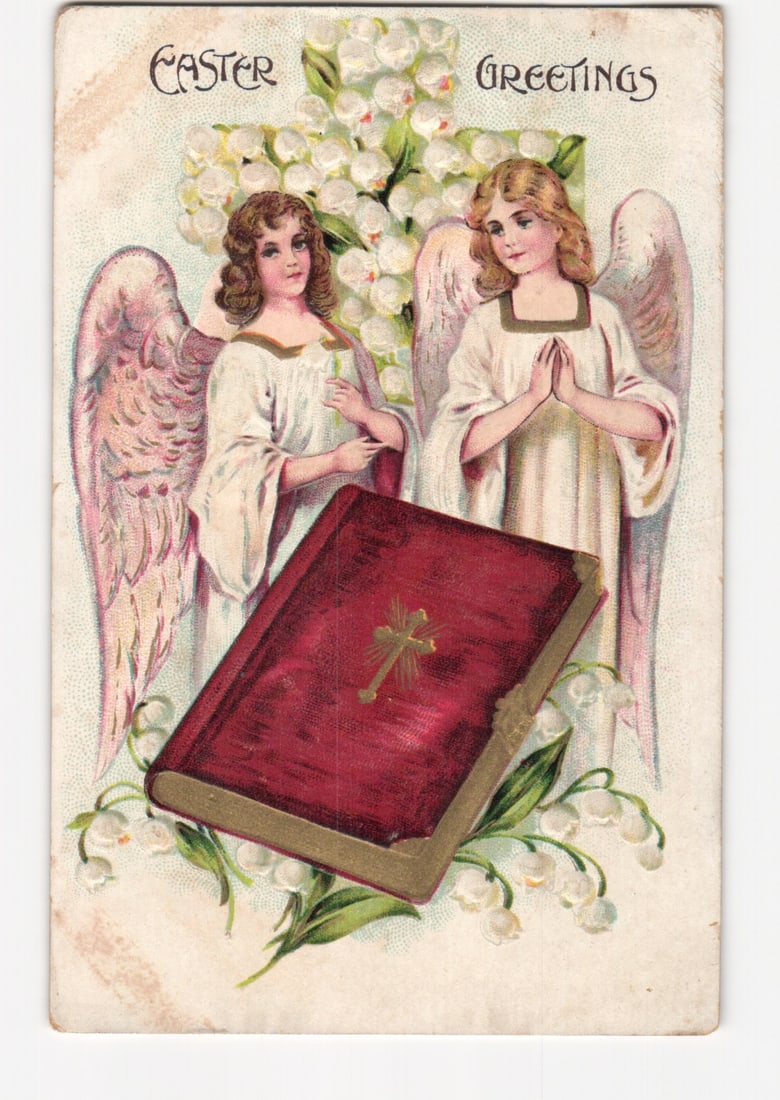 Chromolithograph Postcard Depicting Two Angels, a Floral Cross, and Holy Book for Easter Greetings,: Two angels with pink wings and white robes stand before a cross-shaped arrangement of white lily-of-the-valley flowers. One angel faces left, holding a stem, while the other faces right with hands cla