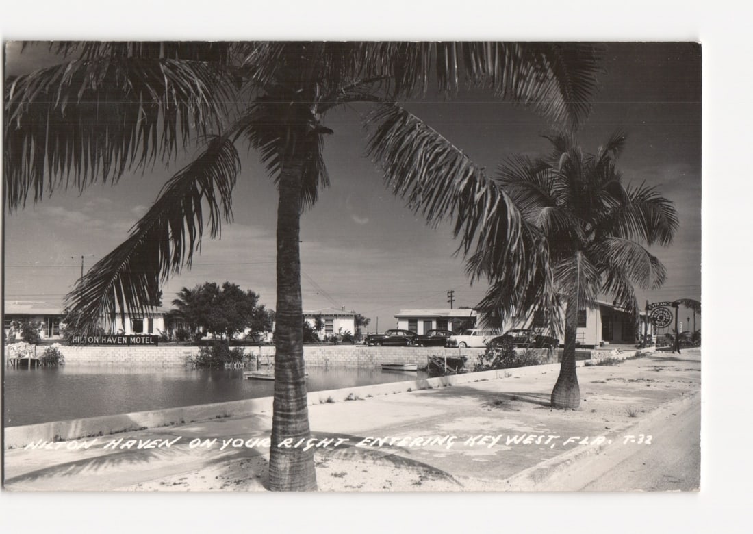 Hilton Haven Motel entrance, Key West, Florida, 1950s street scene with palm trees postcard (1 of 2)