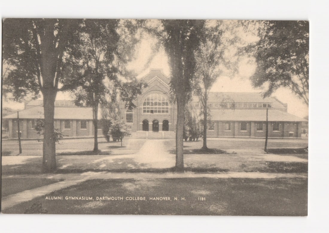 Alumni Gymnasium, Dartmouth College, Hanover, New Hampshire early 20th-century postcard: A photographic print postcard depicting the Alumni Gymnasium at Dartmouth College, Hanover, New Hampshire. The substantial brick building features a prominent central section with an arched main entra