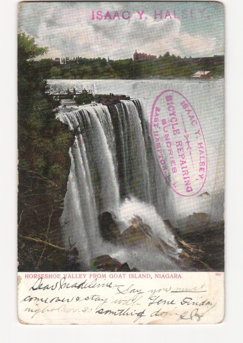 Horseshoe Valley from Goat Island, Niagara, 1906 Photochrome Postcard with Bicycle Repairing Ad: A panoramic view of Horseshoe Valley from Goat Island, Niagara, showing the powerful Horseshoe Falls cascading into the gorge below. The waterfall dominates the center of this colorized photograph, wi