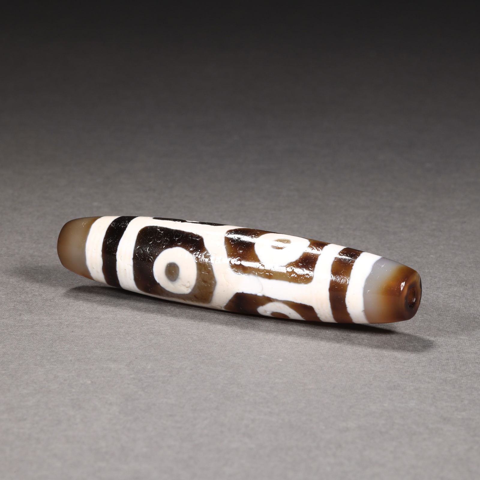 Tang Dynasty tortoise shell six-eyed dzi beads: Tang Dynasty tortoise shell six-eyed dzi beadsH6.8cm W1.5cm Wight23g