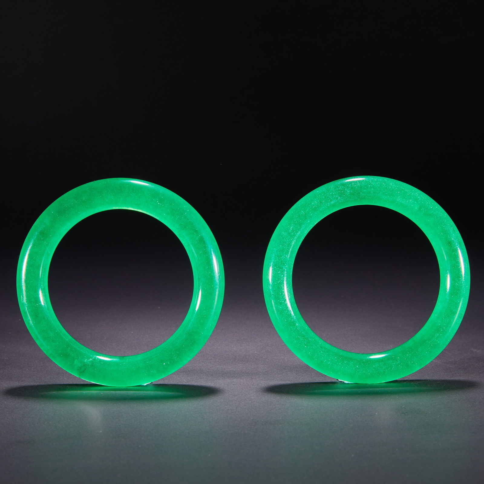 A pair of Qing Dynasty jade bracelets: A pair of Qing Dynasty jade bracelets, H: 8cm W: 8cm Weight: 126g