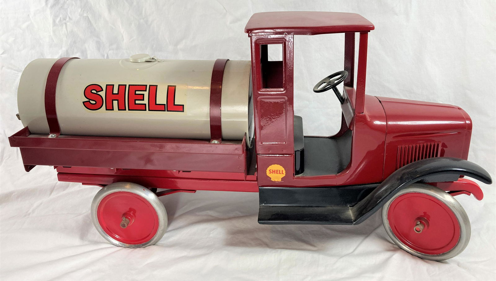 Buddy L Sturditoy Pressed Steel Shell Oil Petroleum Gasoline Model T Tanker Truck: This is a wonderful toy in very good condition. It shows minor wear overall. Some dust present from display. Appears to have been professionally restored to its former glory. Metal tires. Functioning