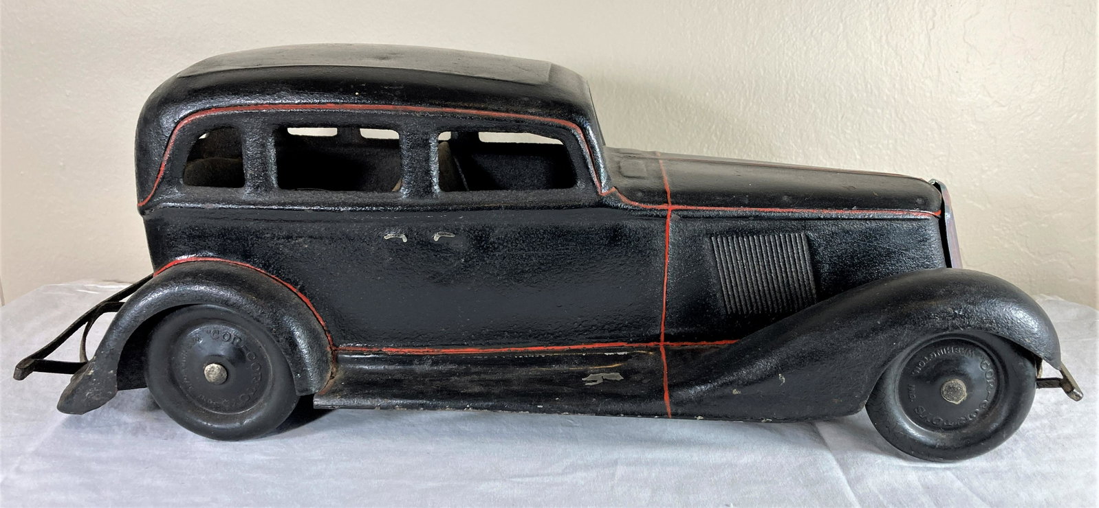 Cor-Cor Graham Large Scale Pressed Steel Sedan Toy Car: This appears to be an original car that has been “restored.” Paint does not appear to be original. Tires are likely original. Shows use. Grill likely a replacement. Large, approximately 20 inches 