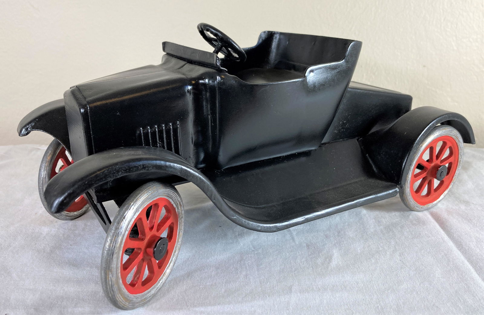 Buddy L Fliver Model T Ford Tin Lizzie Pressed Steel Toy Car: This is a wonderful toy in very good condition. It shows minor wear overall. Some dust present from display. Appears to have been professionally restored to its former glory. Excellent workmanship. Me