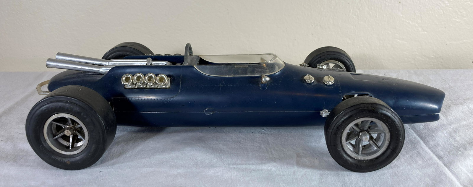 Cox Gurney Eagle Tether Control Line Gas Powered Racer Racecar Model: This is a wonderful toy in very good condition. It shows minor wear overall. Some dust present from display. Approximately 12 inches long.