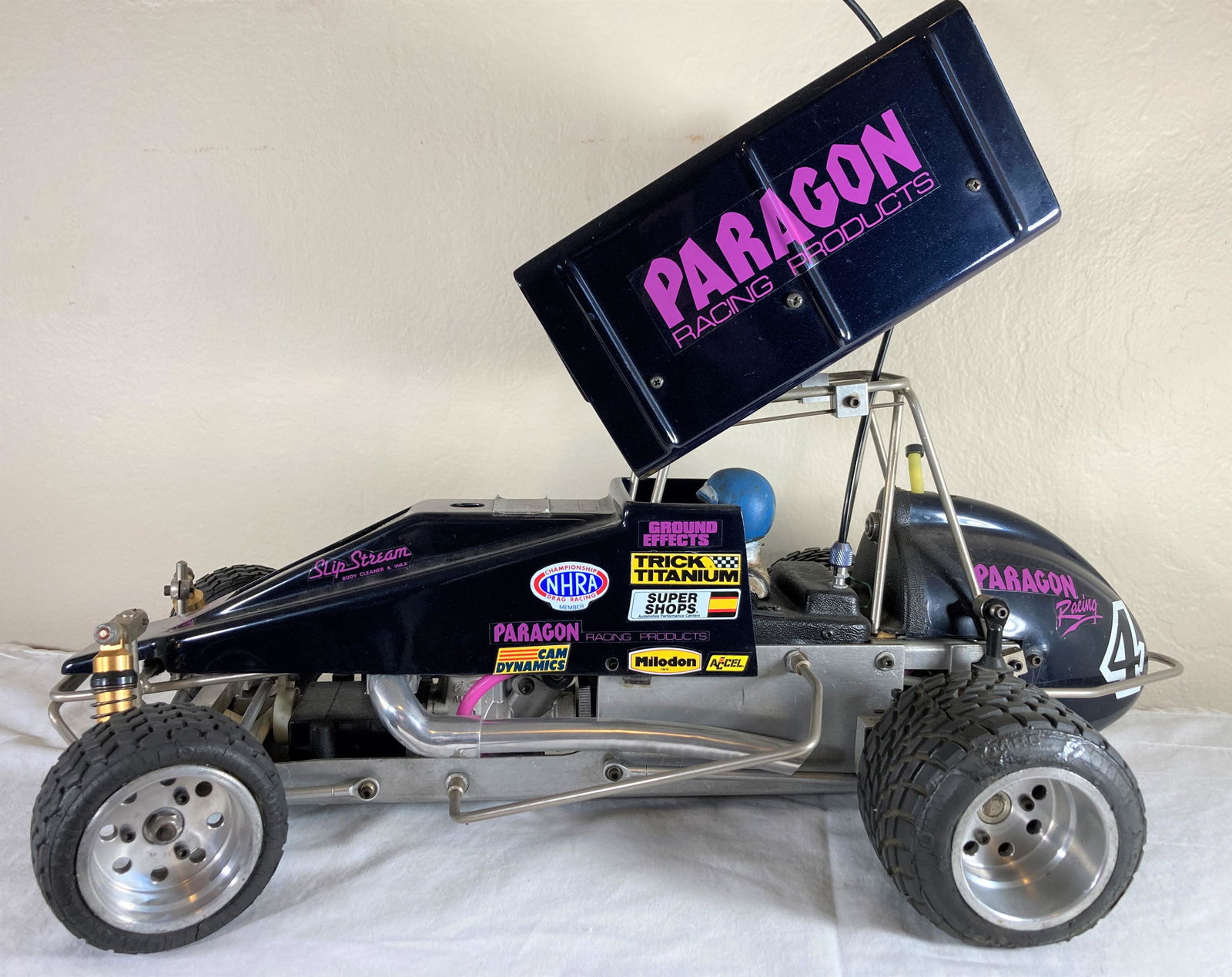 Moody Automotive Sprint RC Racecar Racer Model 1:8 Dynamic Suspension: This is a wonderful toy in very good condition. It shows minor wear overall. Some dust present from display. This appears to be a Roy Moody Automotive Production. The suspension work is just incredibl