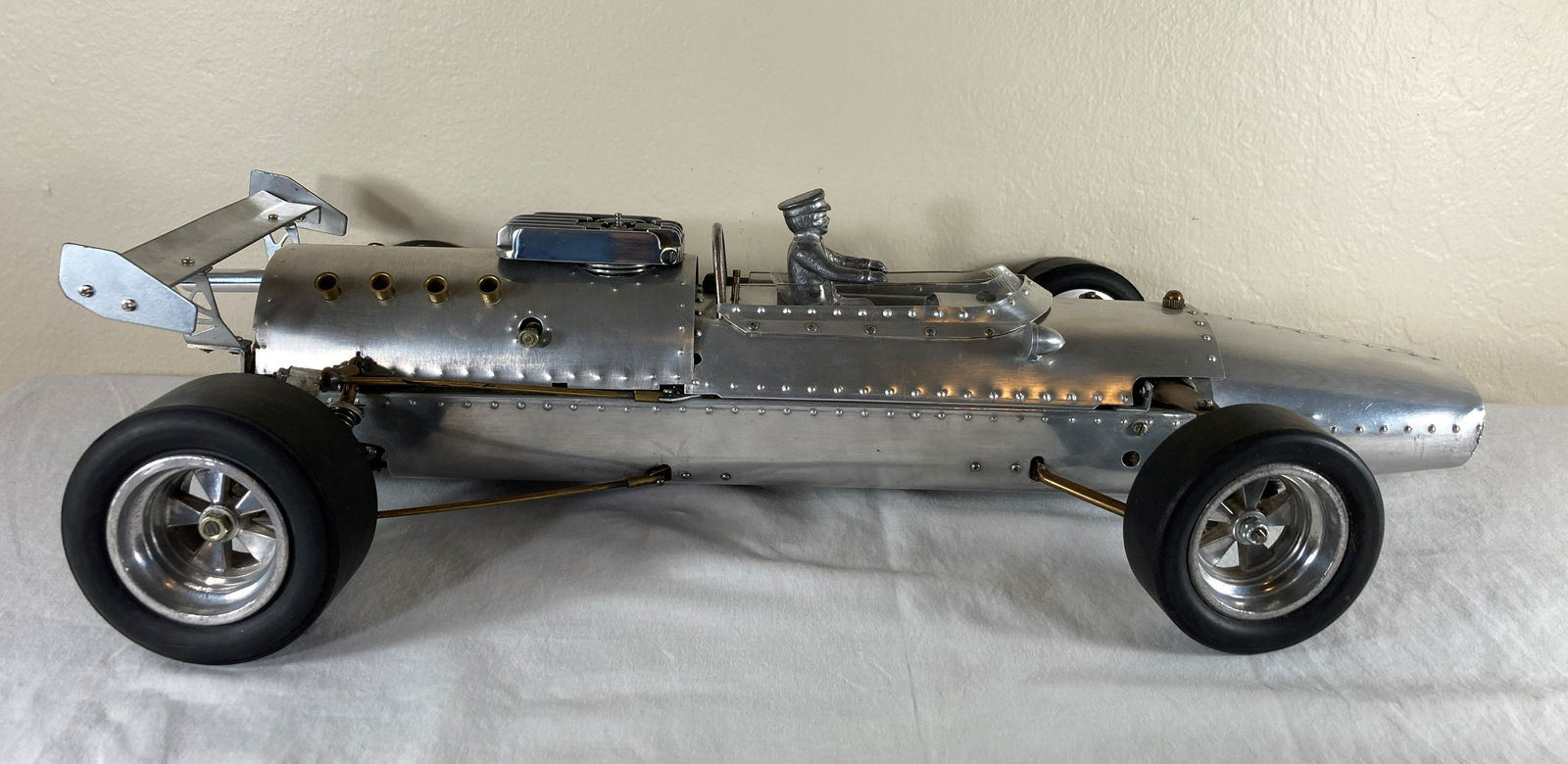 Riko Formula 1 F1 Aluminum Tether Car Racer Racecar Model Dynamic Suspension: This is a very rare model kit that was manufactured by Riko around 1965. It came as a complex kit that had to be assembled. Full independent suspension, motor, rear end, fuel tank. Has an engine. Unte