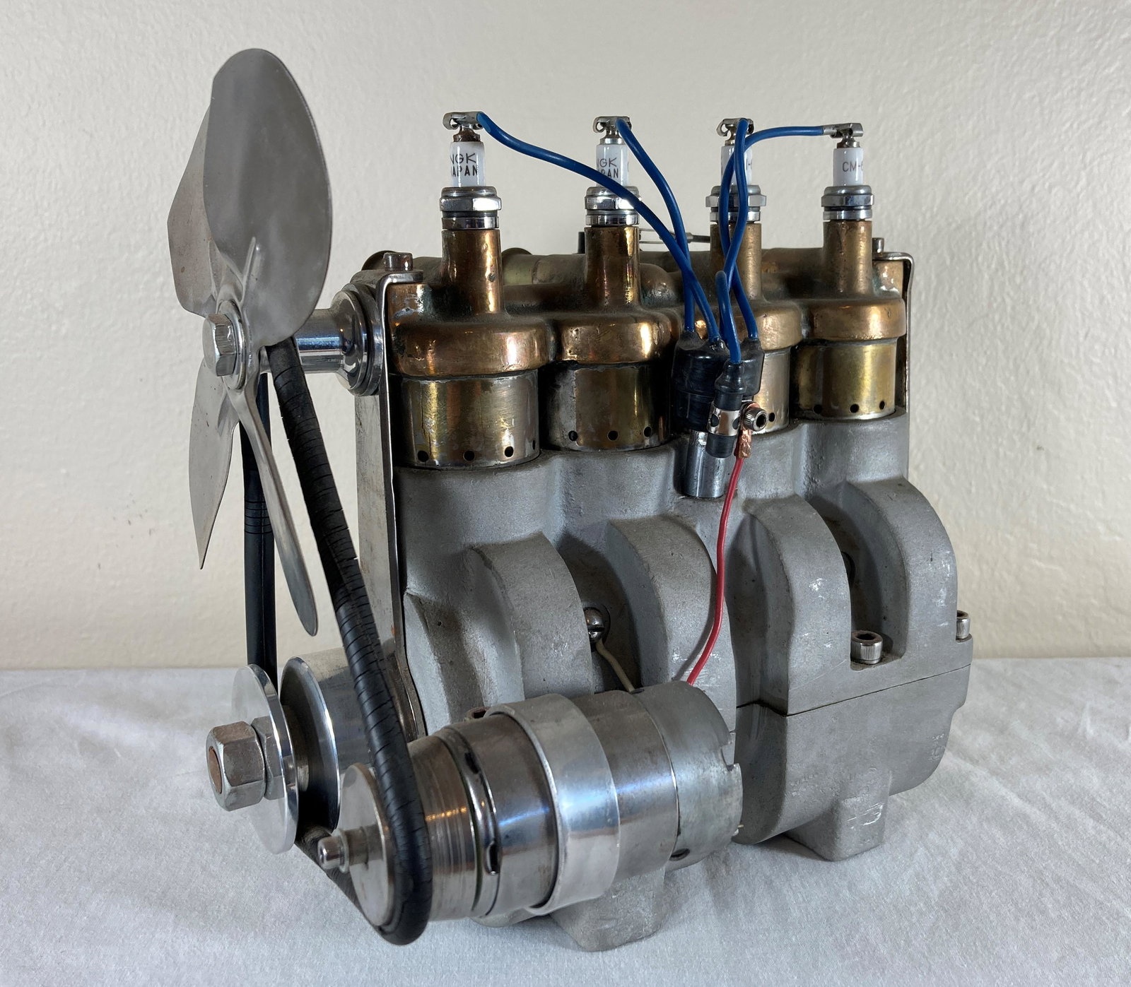 Faux 4 Cylinder Model Car Engine: This was made from a 1910s Kellogg air compressor pump and has been made to look like an early car engine. Heavy and decent sized. Approximately 12 inches long.