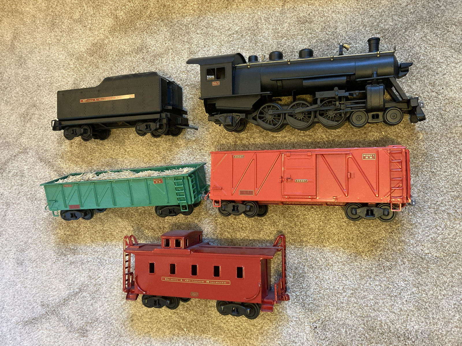 Buddy L Outdoor Railway Railroad Set: All professionally restored. Locomotive, tender, open hopper, box car, caboose. Large scale. Some dust from display. These are large – approximately 18 inches each. The locomotive is very heavy.