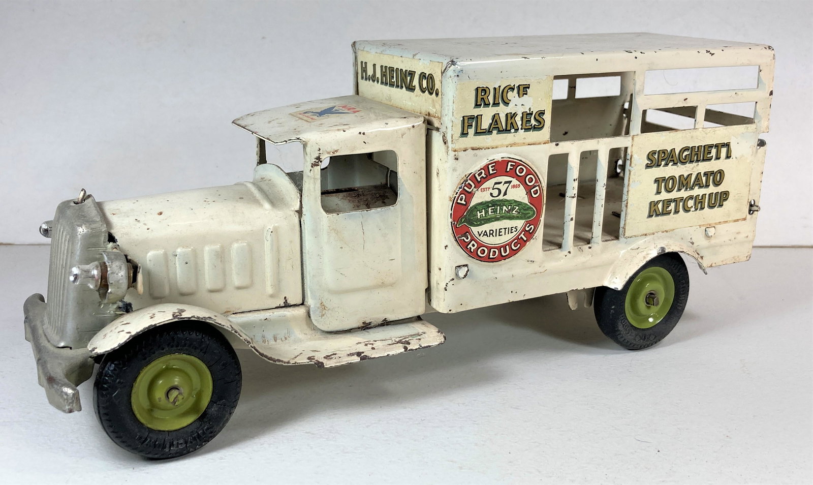 Metalcraft Heinz 57 Pressed Steel Delivery Truck Toy Vehicle: This is a very nice original truck. Decals mostly intact. Original paint. Rear tailgate moves. Headlights present, but untested. Approximately 12 inches long.