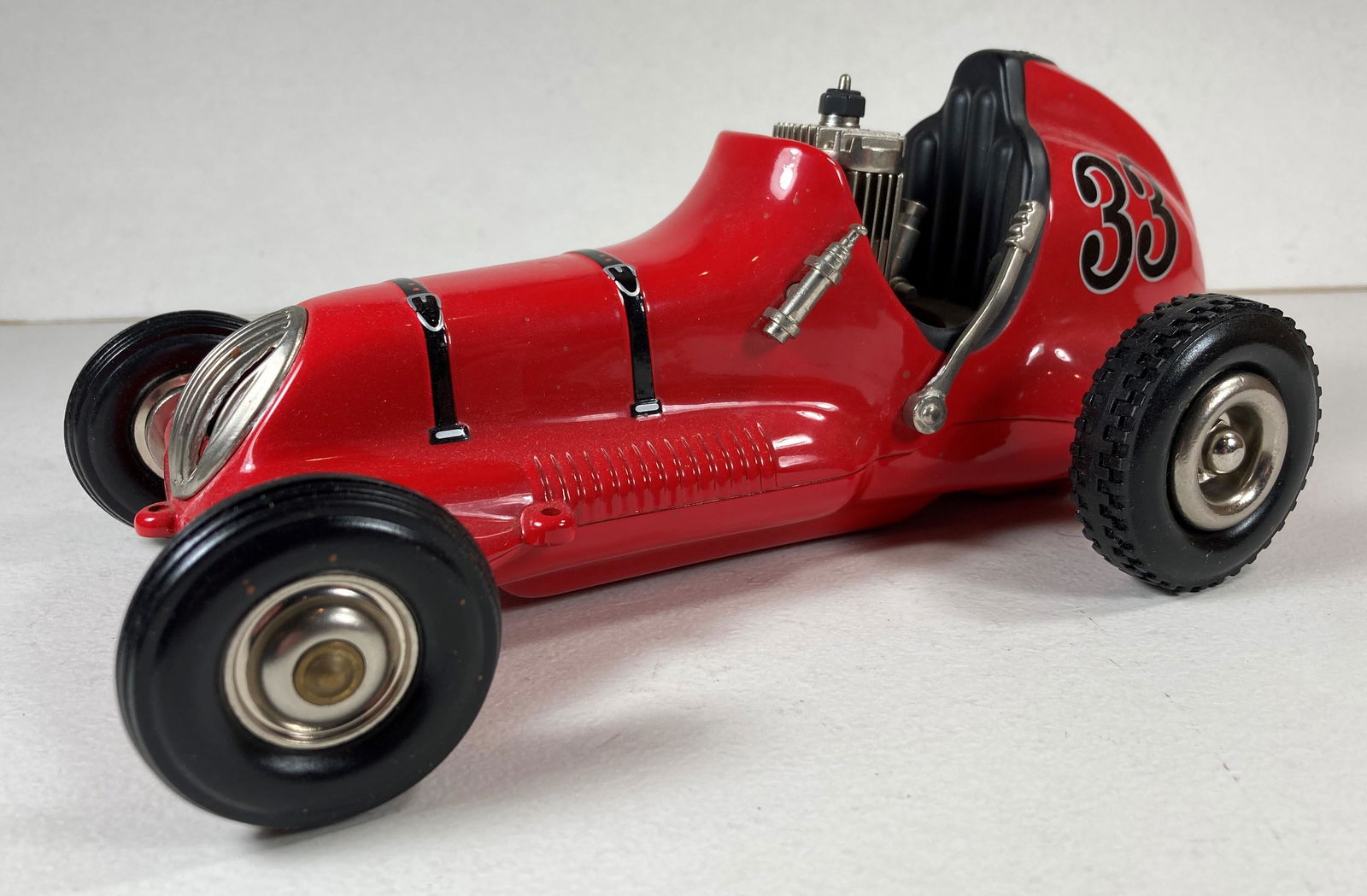 Nylint Cox Thimble Drome Tether Car Model Spindizzy Toy Red: This is a wonderful example of the 1990s Nylint Reissue. Some dust from display. Excellent condition overall. Engine and rear end present. New, never run.