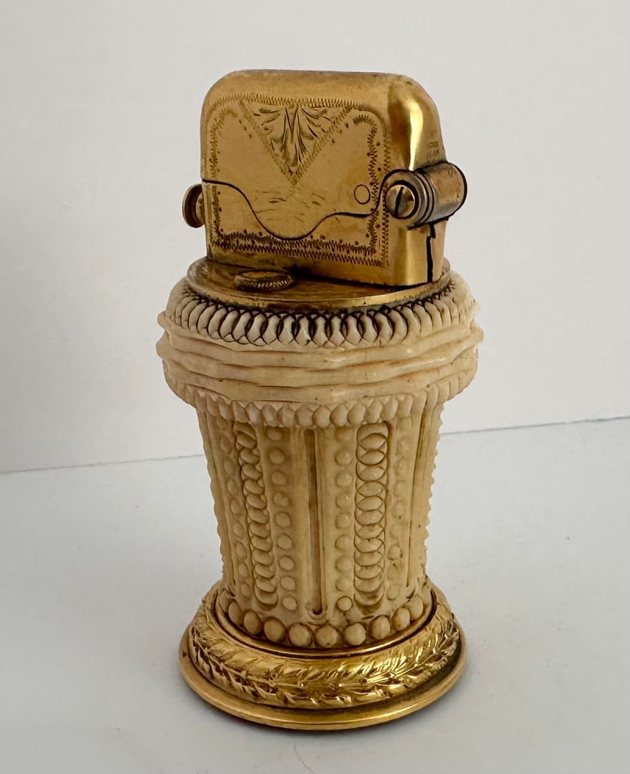 Antique Gentlemans Bone and Brass Table Cigar Lighter: This is a Beautiful Antique Gentlemans Bone and Brass Table Cigar Lighter...Very ornately detailed with a fine mechanism. Measures 3 1/2 inches tall.