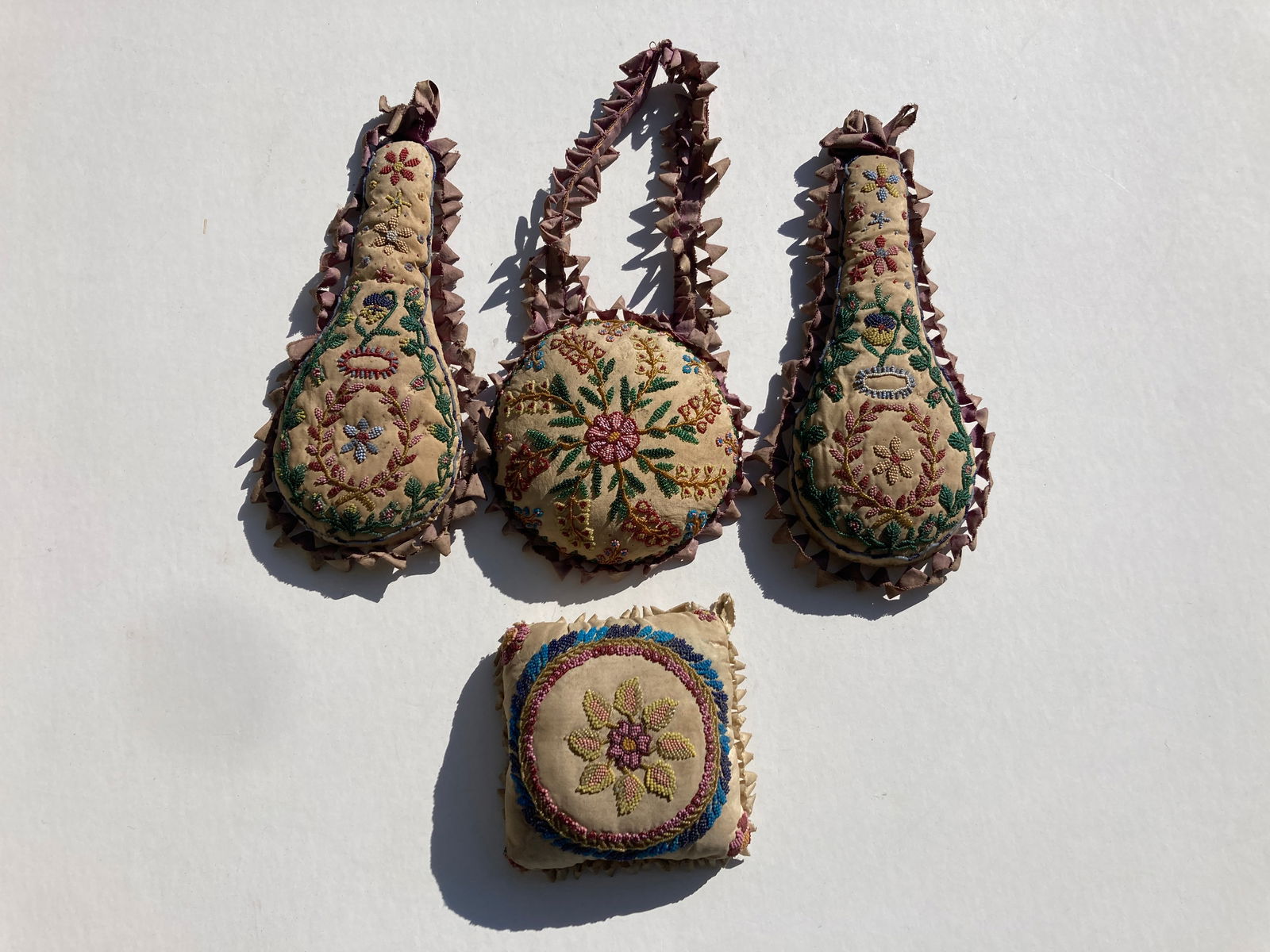 Lot of Victorian Era Beaded Decorative Pillows: This is a very nice set of 4 Victorian era pillows. Each detailed in beads. Very nice overall.