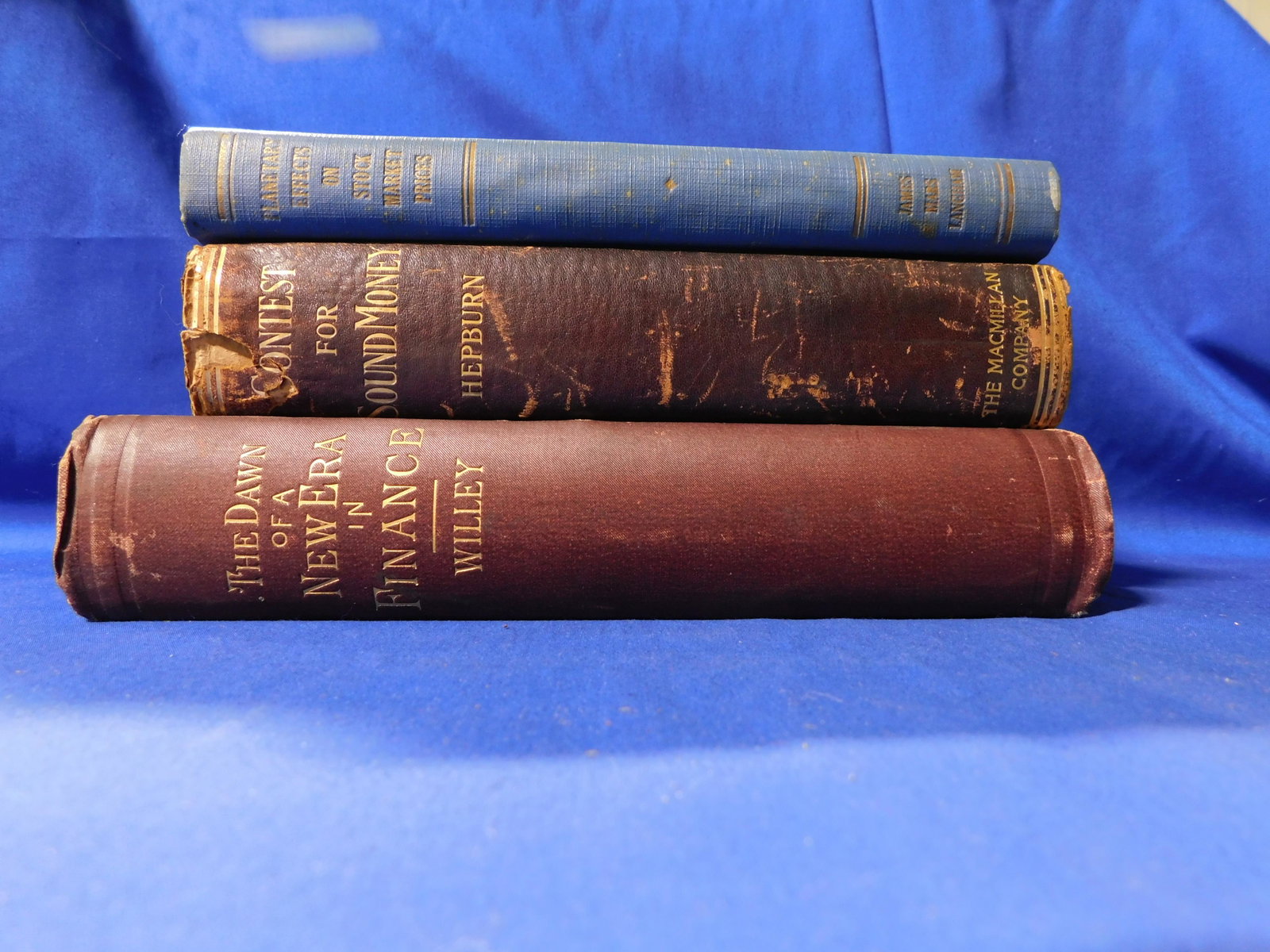 3 Books on Economics: Hepburn, A. Barton, Langham, James Mars, Willey, Freeman O. 1903, 1932, 1887. All in cloth covers with gilt lettering, ‘87 embossed and in great condition.