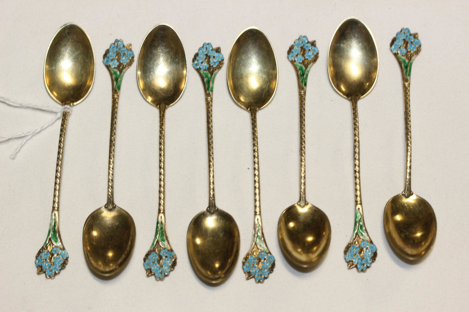 set of eight small decorative sterling silver tea spoons with bouguet of blue flowers (1 of 8)