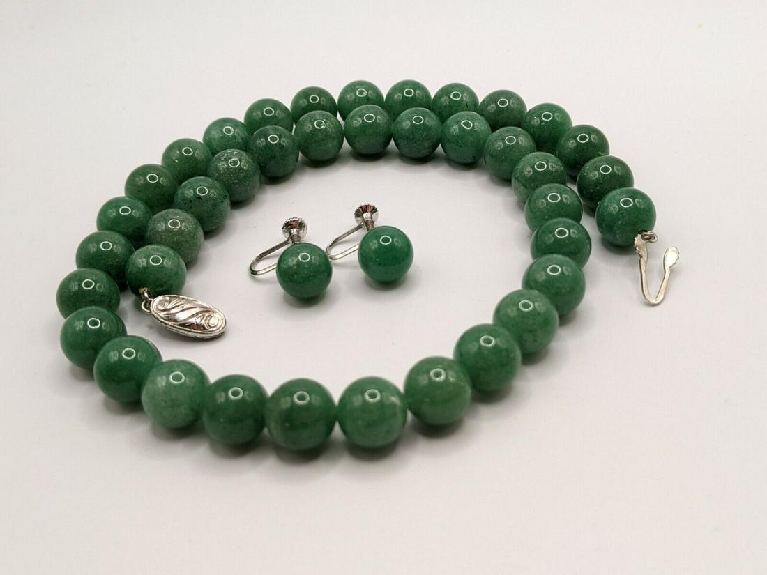 Collectible Chinese Antique Jade Beaded Jewelry Set: This stunning vintage necklace and earrings set is a true gem. The necklace features 0.38" (inches) green jade beads strung together in a 17"L (inches) strand, with a secure clasp closure. The matchin