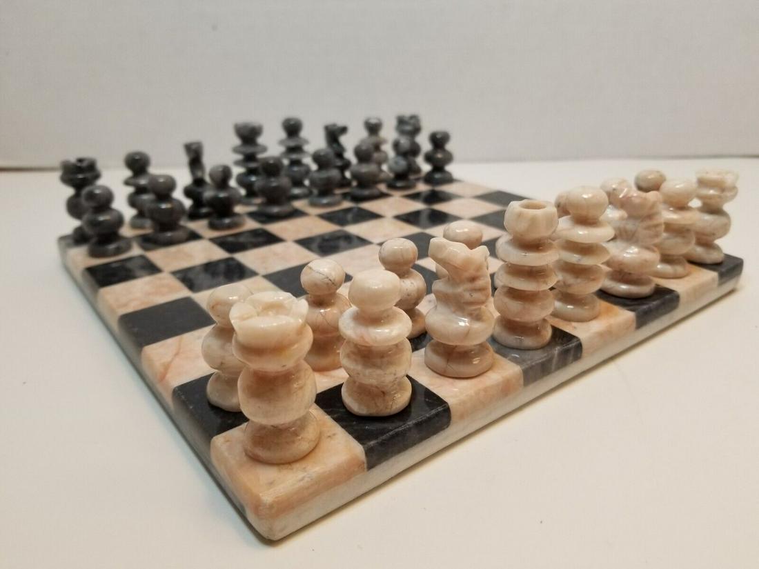 Amazing Vintage Stone Chess Set Board Carved Pieces: This is an amazing handmade vintage Stone Chess Set. The chessboard measures 8" x 8" x 0.5" (inches) and the king highs 1.5" (inches). The chess set is made of stone in beige and black colors. Lot in