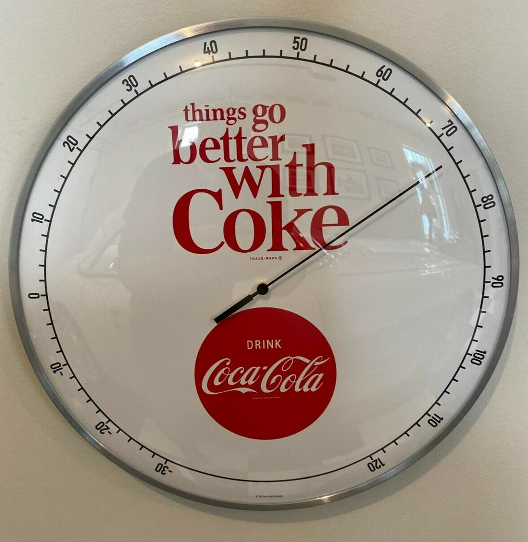 Retro-style Coca-Cola Collectible Ad Thermometer: Vintage-style Coca-Cola soda round thermometer. This officially licensed product features the iconic white and red Coca-Cola logo and phrase. Measuring 12" (inches), it showcases a glass front and alu