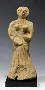 North Syrian Style Bird Face Goddess: Probably Bronze Age, 2nd Millennium BC. Most likely Amorite, but potentially Early/Middle Assyrian. Buff pottery abstract Goddess with incised skirt and rounded applied breasts. Her bare and emphasize