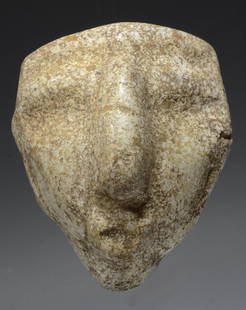 Pre Columbian Chontal Flecked Stone Mask: Guerrero, Mexico, Ca. 400 B.C. Probably Olmec. A thick carved mask having a long nose, well-defined brow and a pecked, concave surface. Simple lug type ears and a perforation at the top for