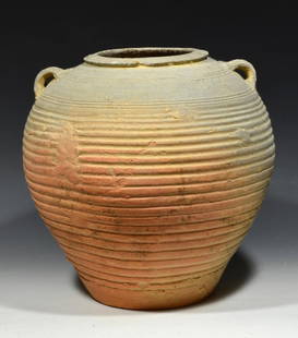 Ancient Chinese Warring States Grayware Pottery Vessel: Chinese Warring States ca. 475-221 BCE. A grayware wheel thrown pottery vessel having 2 small applied strapped handles on the shoulders, both have a low relief ridged decoration. Tapered conical body