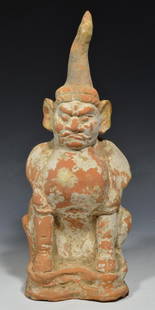 Chinese Tang Dynasty Terracota Earthspirit Figure: Chinese Tang Dynasty 618-907 AD. Terracota tomb guardian. This Lokapala statue is a warrior image. He wears a helmet, a strap, and a suit of armor. His awesome physical attributes, including glaring