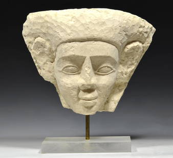 Egyptian Limestone Anthromporphic Sarcophagus Mask: Egyptianâ€“Late Period, ca. 700-300 BCE. Facial section of a limestone sarcophagus showing a man's face with deep-set eyes, well formed nose and raised thin lipped mouth. Large ears at sides and