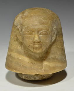 Egyptian Human Headed  Alabaster Lid for a Canopic Jar: Probably Late Period Ca 715 to 300 BCE. A well carved alabaster Lid for a Canopic Jar representing the human-headed son of Horus, Imsety carved with the ears protruding from the full rounded wig, the