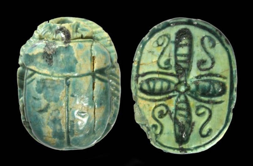 Egyptian Green Glaze Steatite Scarab: Ca. 1200 BC Naturalistic carved green glazed steatite beetle; a carved design base depicting scrolliate blossom symbolic for the Pharaohs protection. Pierced for suspension. Size 1/2 inches long (13 m