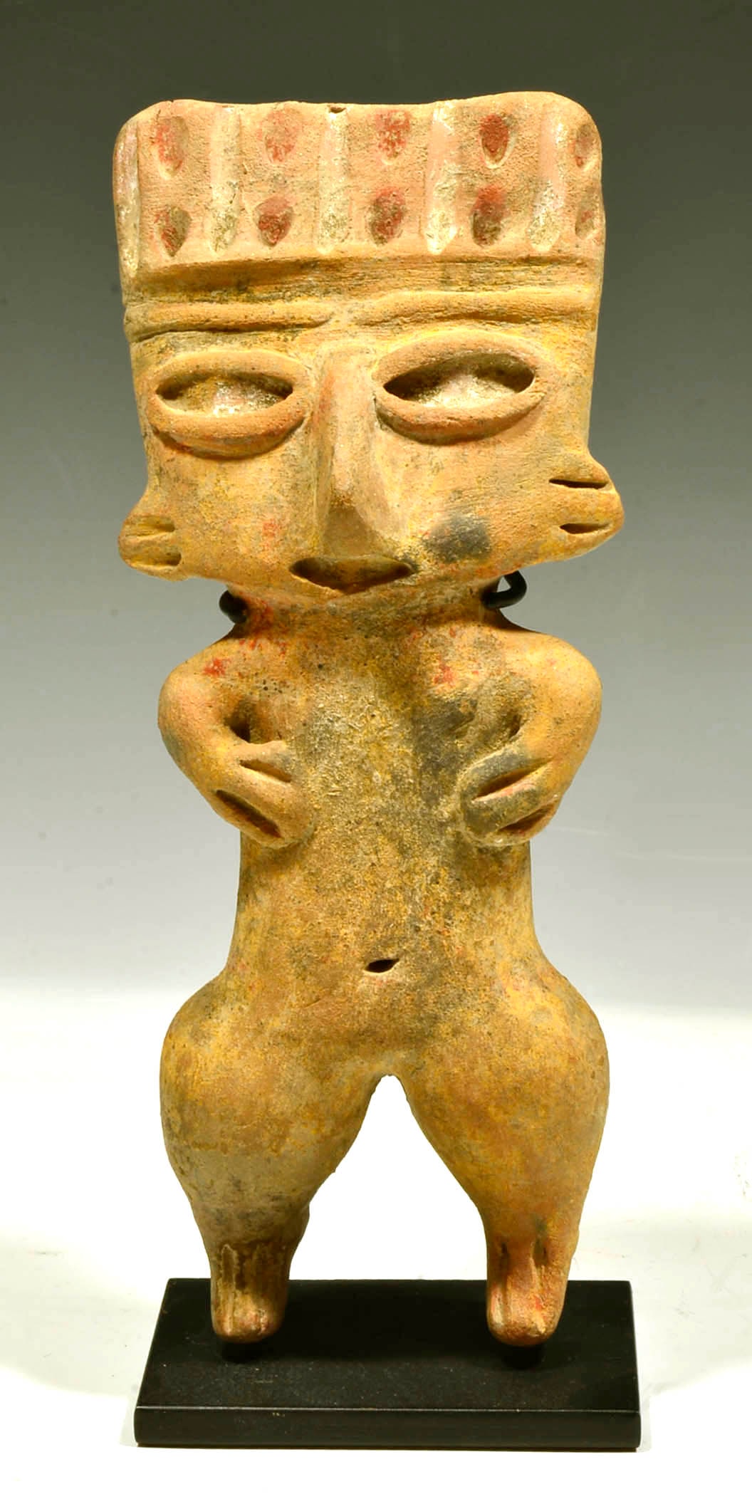 Fine Michoacan Pottery Female Pretty Lady: Pre Classic Period, ca. 800 to 200 B.C. A rare large solid pottery standing nude female of formal geometric form. She has a large square head with oval eyes, rectangular torso and protruding curved hi