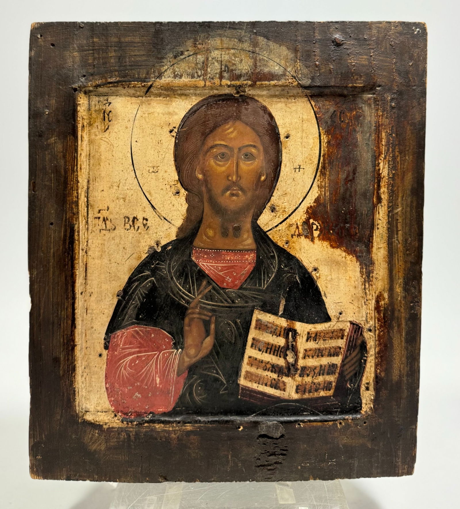 Russian Icon of Christ Pantocrator: Late 18th to early 19th century AD. Tempera over gesso painted on a thick wood panel with bust of the compassionate Christ in blessing. "Pantocrator" means "All-Ruler." This icon shows Christ as Creat