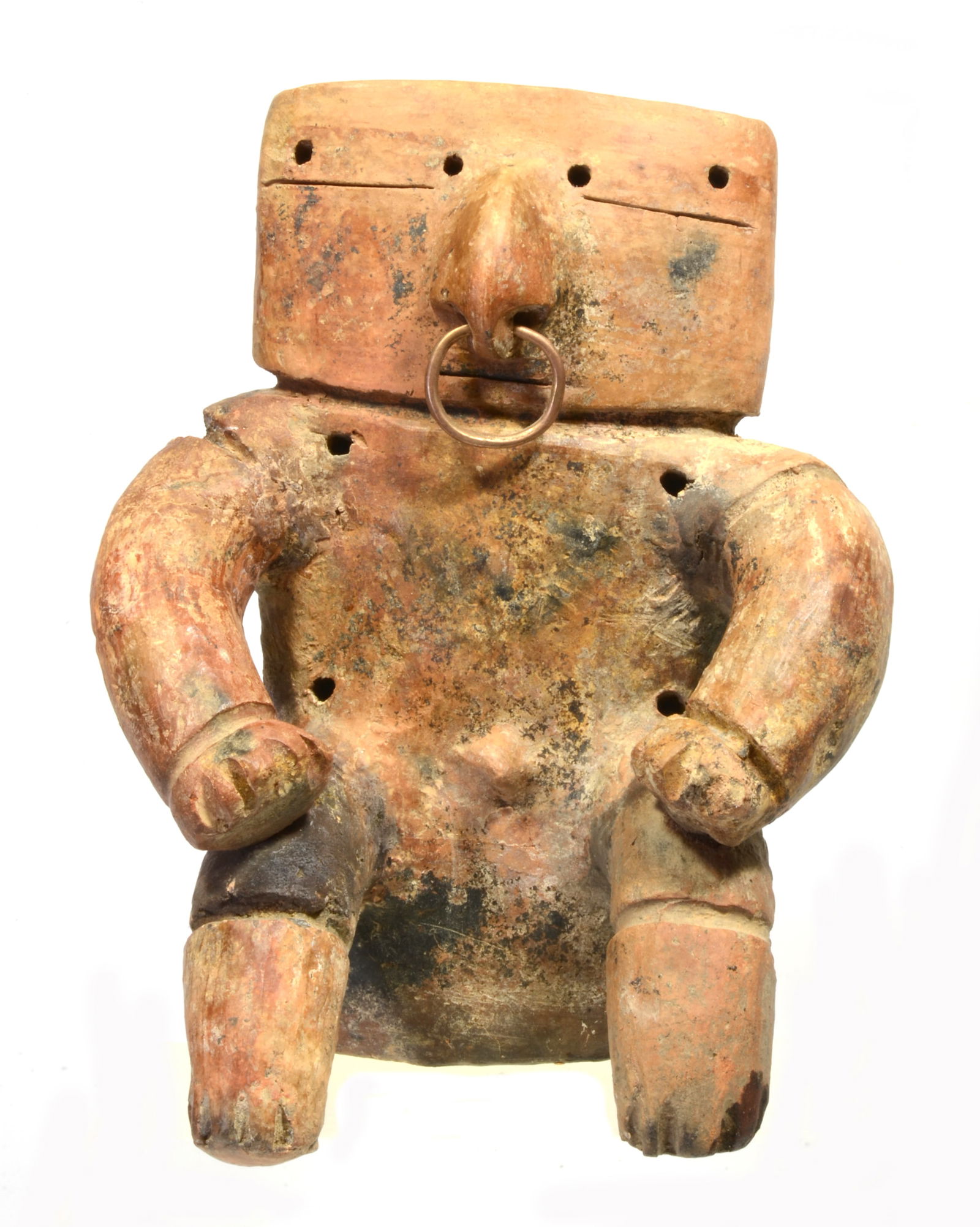 Quimbaya Abstract Pottery Retablo Figure: Colombia, SA, Ca. 800 to 1200 AD An abstract figure a male seated figure with cylindrical protruding limbs, remains of applied pigments and body piercing. Copper hoop nose ring. He holds hands on knee
