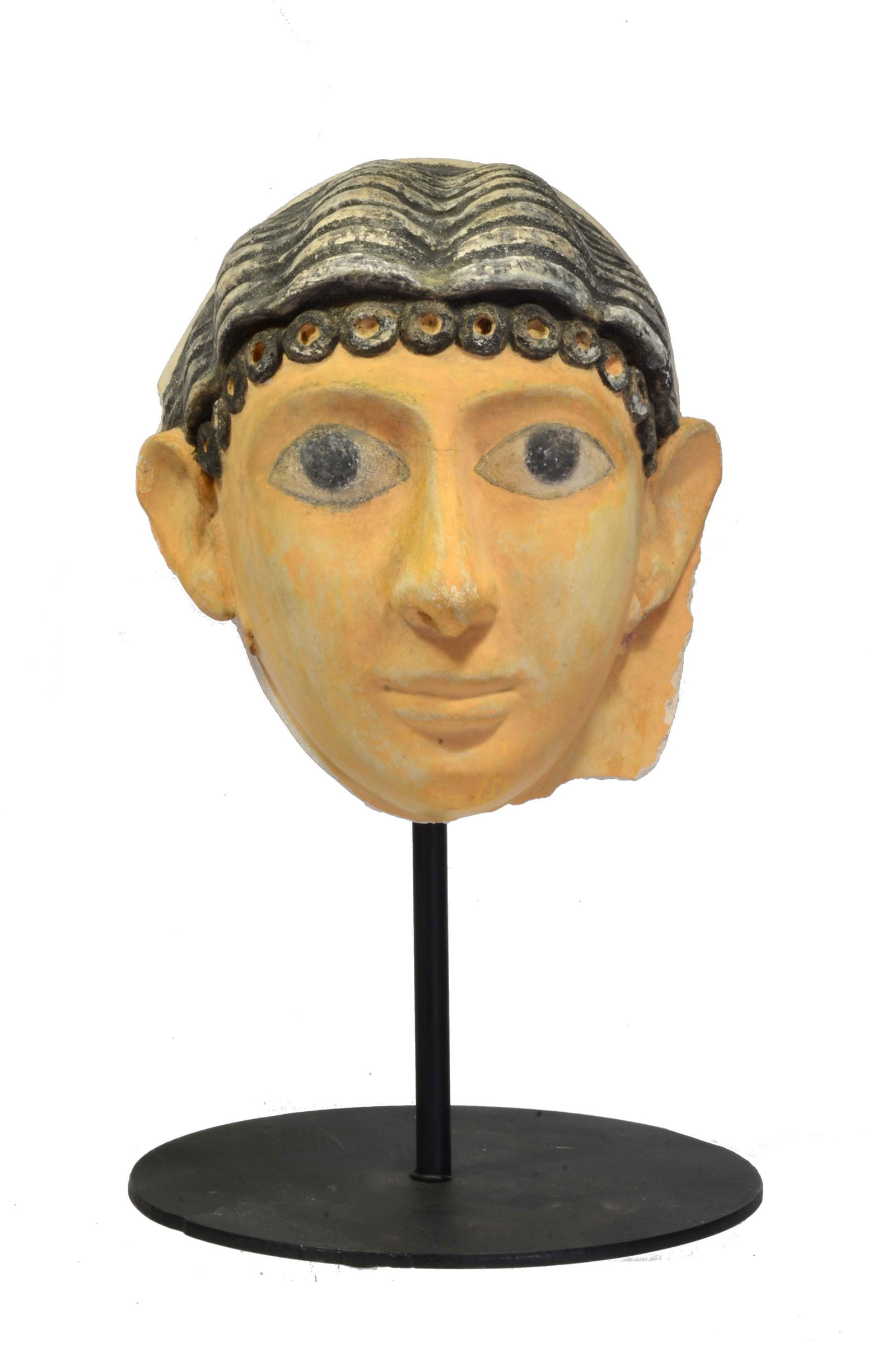 Egyptian Female Plaster Stucco Painted Mummy Mask: Romano-Egyptian Period ca. 30 BCE - 323 AD. A fully modeled sculpted female mask with fine facial features and elaborate hairstyle with little curled ringlets, black pigment to the brow, pupils, eyes,